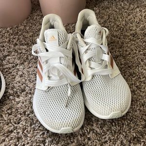 White athletic adidas shoes